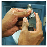 A finished die being examined by an expert die maker for any signs of imperfections